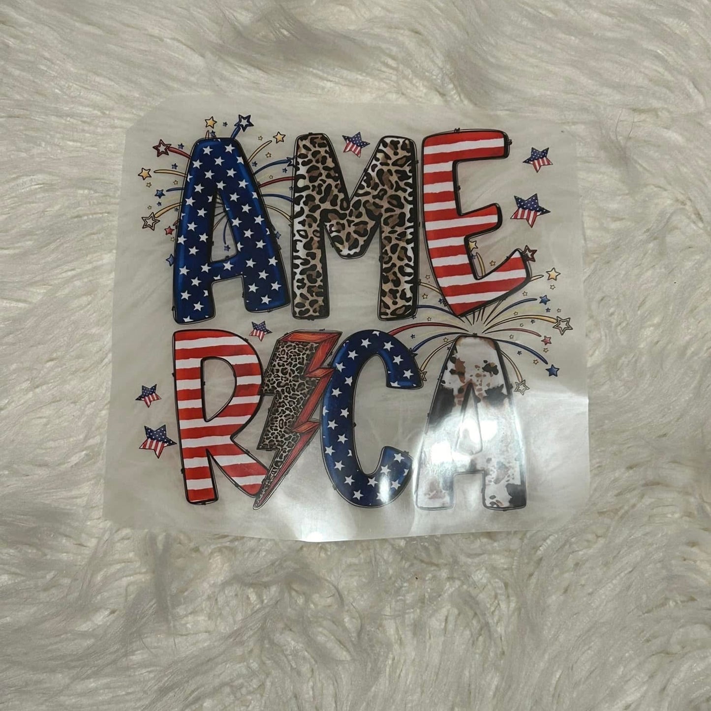 Decorative patch with 'AMERICA' text on a textured white background