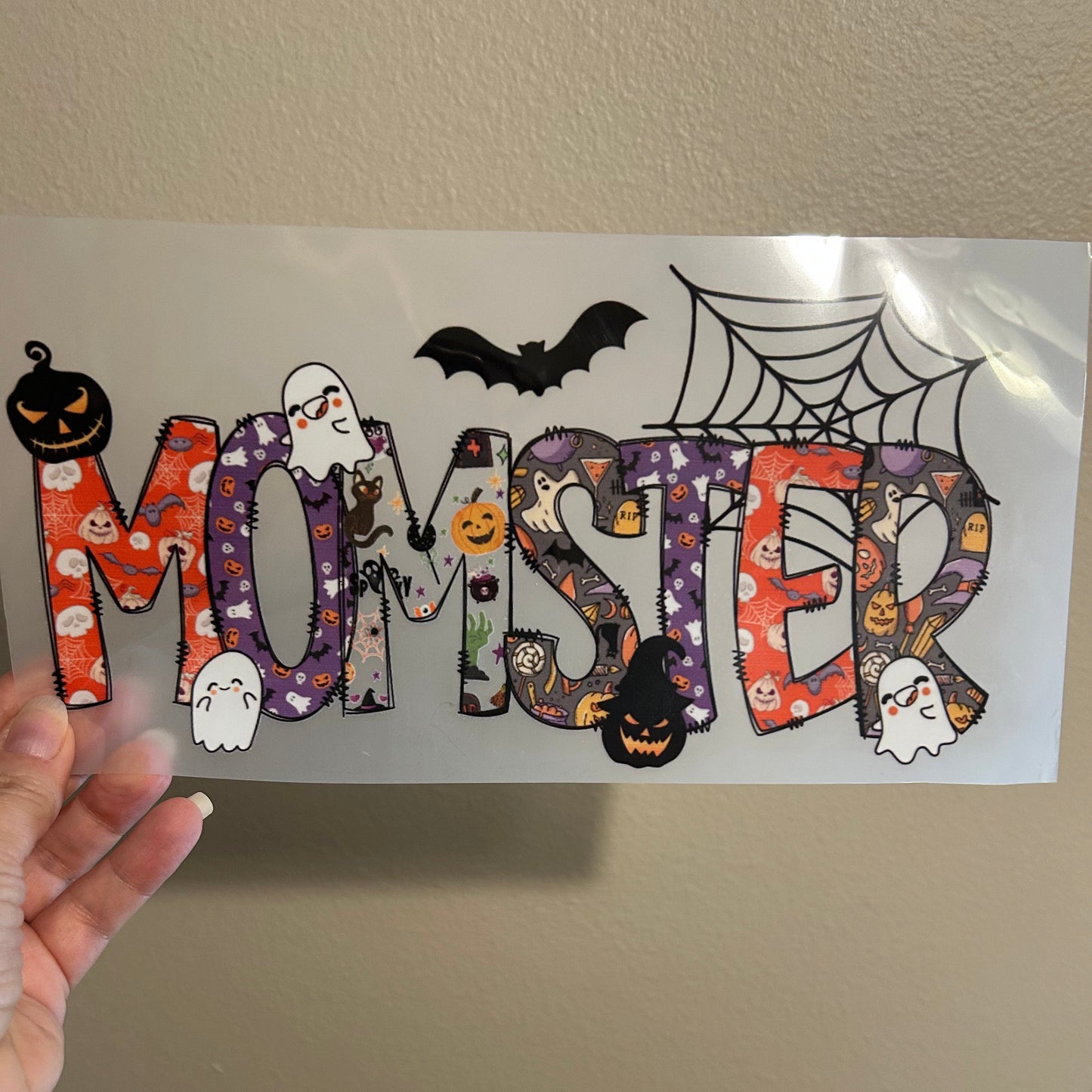 Halloween-themed decorative cutout with a snake design on a plain background