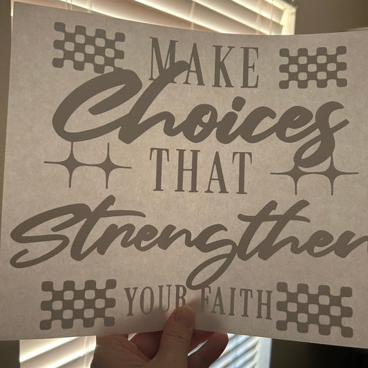 Motivational poster with text 'Make choices that strengthen your faith' held by a hand.
